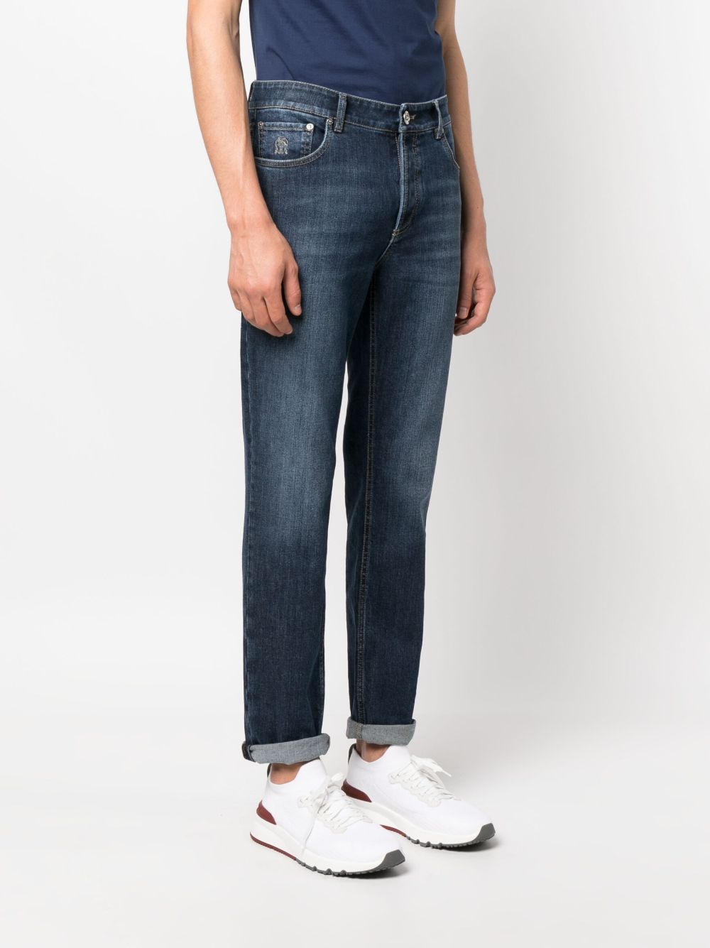 BRUNELLO CUCINELLI Jeans blu con risvolti alla caviglia ed effetto wash