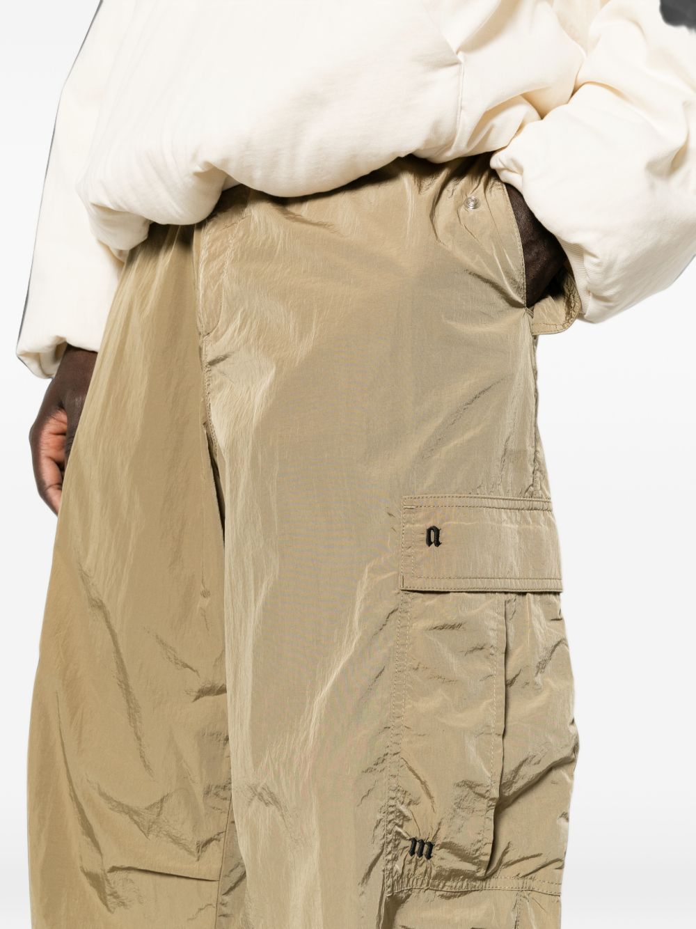 PALM ANGELS Pantalone casual beige in tessuto tecnico lucido