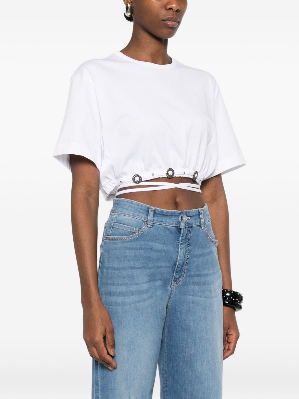PINKO Top bianco con borchie e lacci