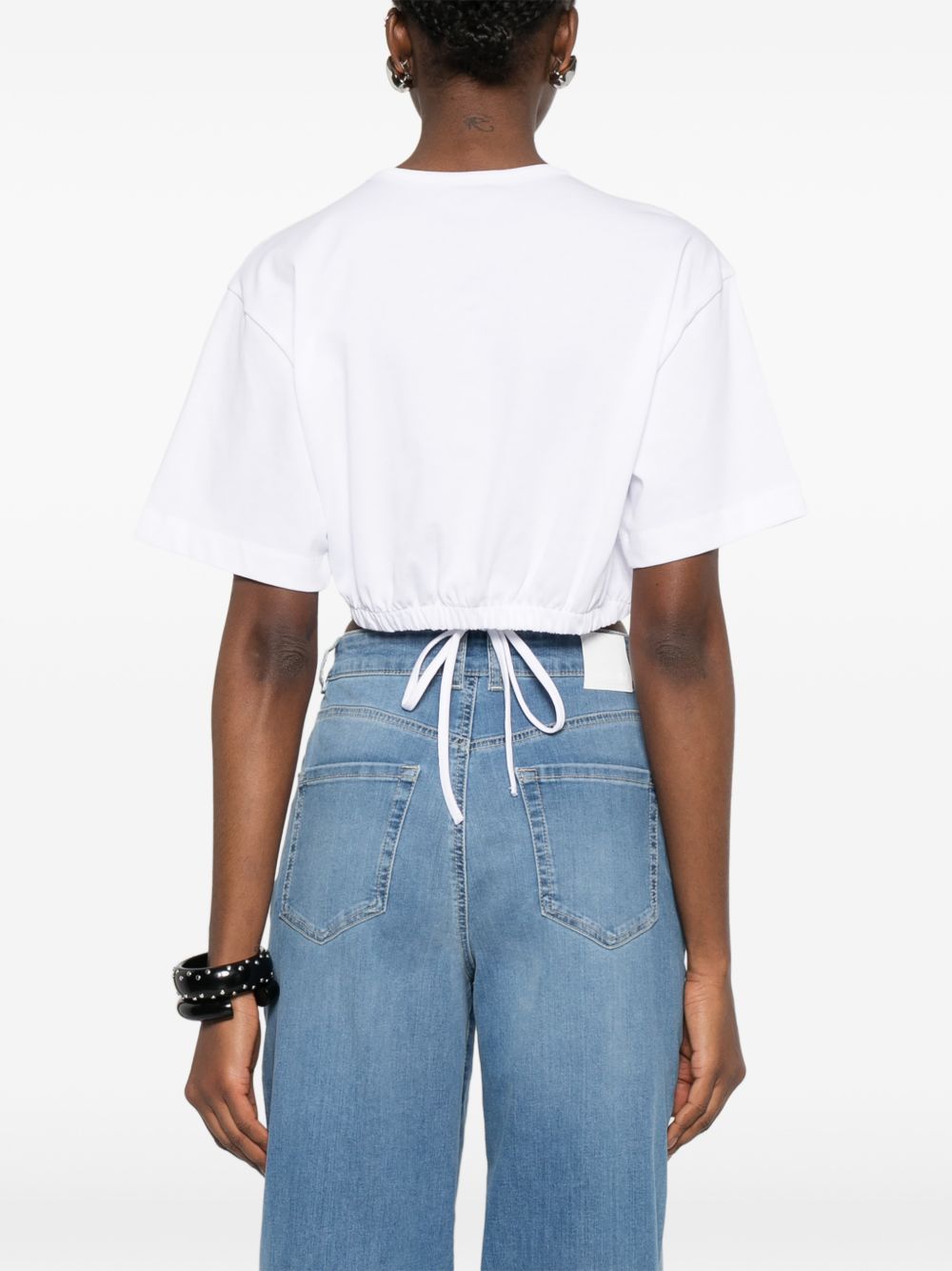 PINKO Top bianco con borchie e lacci