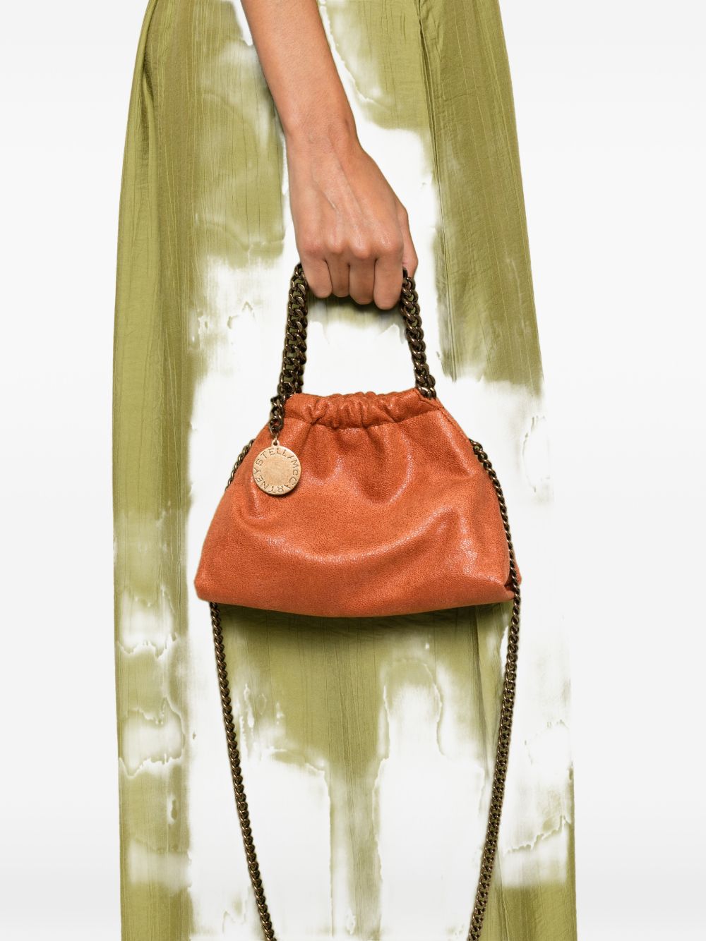 STELLA MCCARTNEY Borsa Falabella Mini Drawstring arancione in materiale vegano 
