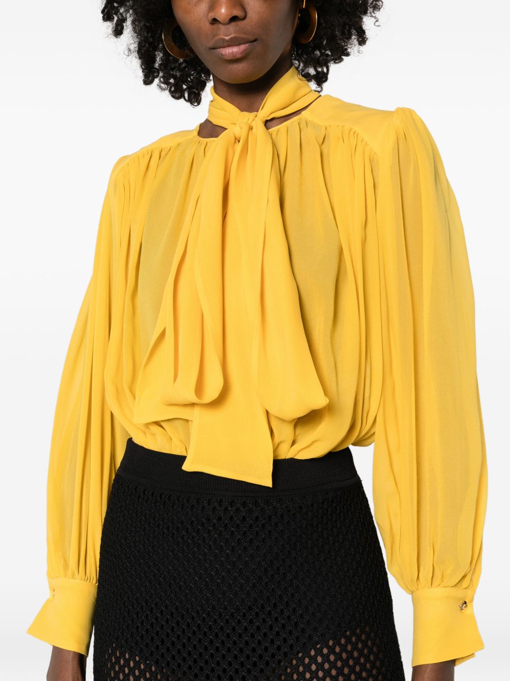 ELISABETTA FRANCHI Body in seta giallo sole con dettaglio plissettato e fiocco al collo 