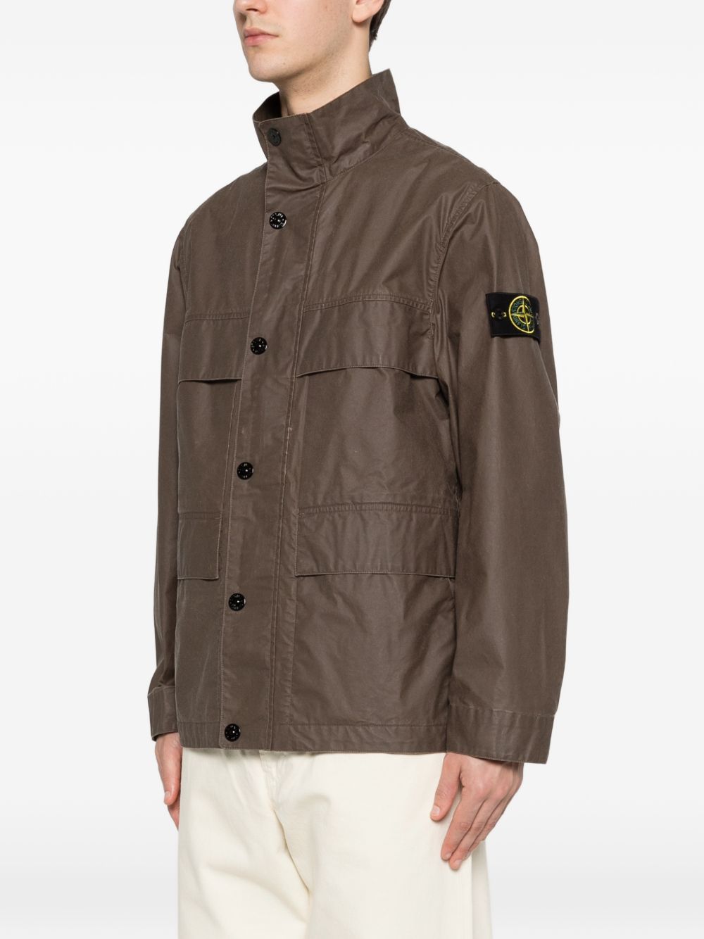 STONE ISLAND Giacca cerata marrone scuro con logo 
